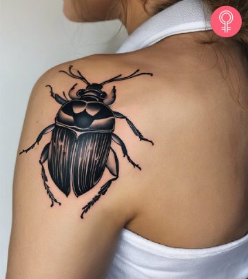 Beetle tattoo on the back shoulder