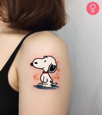 Snoopy tattoo on the upper arm