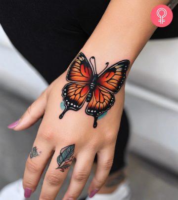 Woman with a butterfly hand tattoo Woman with a butterfly hand tattoo