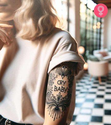 Cry Baby tattoo on the upper arm Cry Baby tattoo on the upper arm