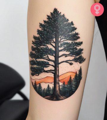 Woman with a pine tree tattoo on her upper arm Woman with a pine tree tattoo on her upper arm