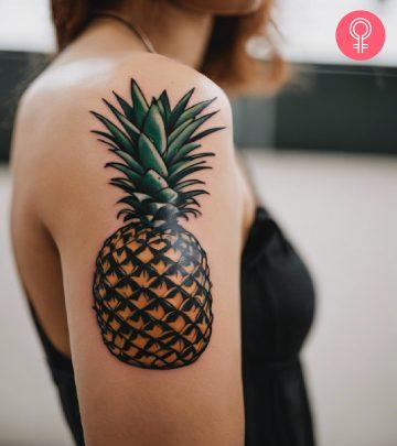 A pineapple tattoo on the arm of a woman A pineapple tattoo on the arm of a woman