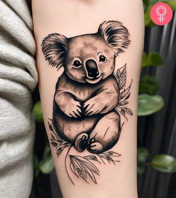 Woman with koala tattoo on her arm Woman with koala tattoo on her arm