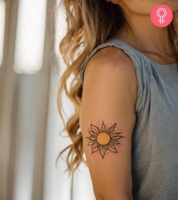 Sunshine tattoo on the arm of a woman Sunshine tattoo on the arm of a woman