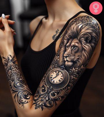 A blackwork lion clock tattoo with a floral design on the upper arm A blackwork lion clock tattoo with a floral design on the upper arm