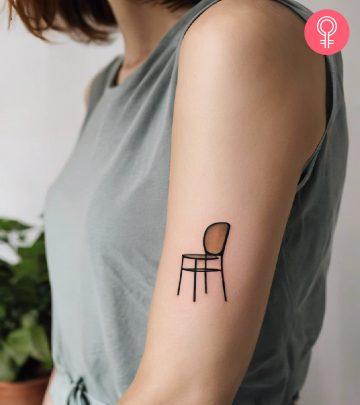 Woman with chair tattoo on her arm Woman with chair tattoo on her arm