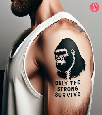 A ‘Only The Strong Survive’ gorilla tattoo on a man’s upper arm A ‘Only The Strong Survive’ gorilla tattoo on a man’s upper arm