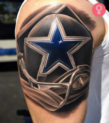 A man with a Dallas Cowboys star tattoo on the upper arm A man with a Dallas Cowboys star tattoo on the upper arm