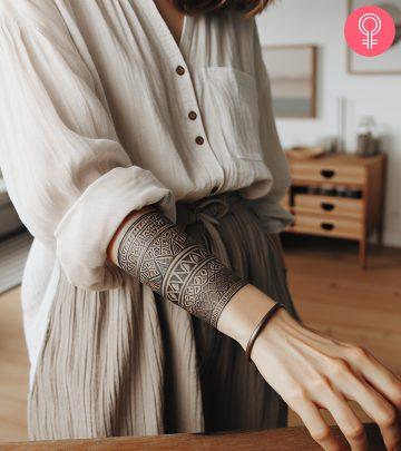 A stylish cuff tattoo design on the forearm A stylish cuff tattoo design on the forearm