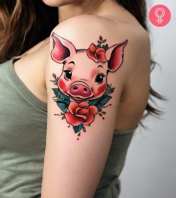 A woman flaunting a pig tattoo on the bicep A woman flaunting a pig tattoo on the bicep