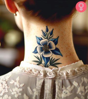 A woman with a Columbine flower tattoo on her neck A woman with a Columbine flower tattoo on her neck