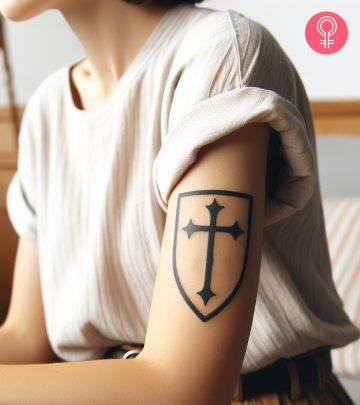 A woman with a crusader cross tattoo on her arm A woman with a crusader cross tattoo on her arm