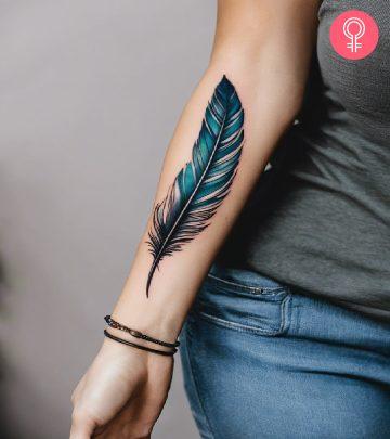 Feather tattoo design on the forearm of a woman Feather tattoo design on the forearm of a woman