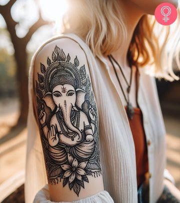 Ganesh tattoo on the upper arm of a woman Ganesh tattoo on the upper arm of a woman