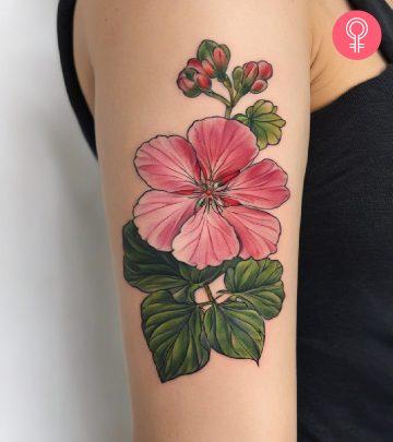 Geranium tattoo on the upper arm of a woman Geranium tattoo on the upper arm of a woman