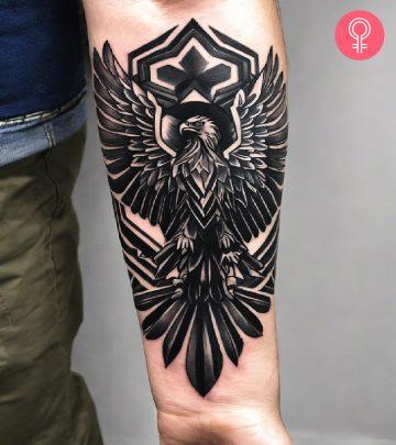Man with a Polish eagle tattoo on the forearm Man with a Polish eagle tattoo on the forearm