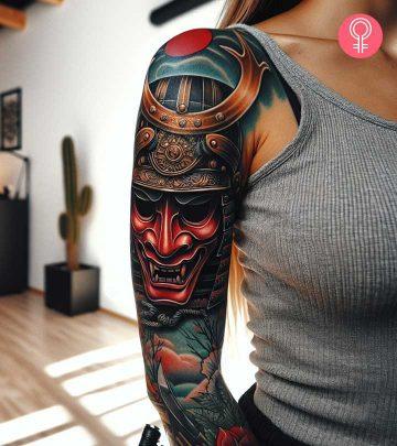 Samurai mask tattoo on the arm of a woman Samurai mask tattoo on the arm of a woman