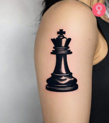 Woman with a king chess piece tattoo Woman with a king chess piece tattoo