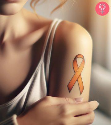 A woman wearing an MS ribbon on her arm A woman wearing an MS ribbon on her arm