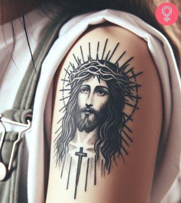 A woman with a Jesus tattoo on her arm A woman with a Jesus tattoo on her arm