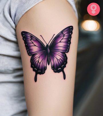 Woman with lupus butterfly tattoo on her arm Woman with lupus butterfly tattoo on her arm